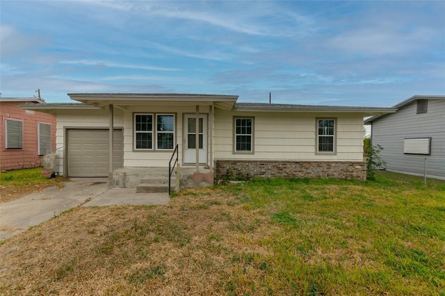 ranch-style house featuring a front yard and a garage