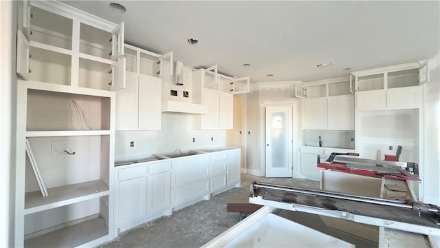 kitchen featuring white cabinetry and open shelves