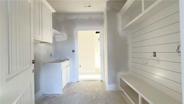 mudroom with concrete flooring