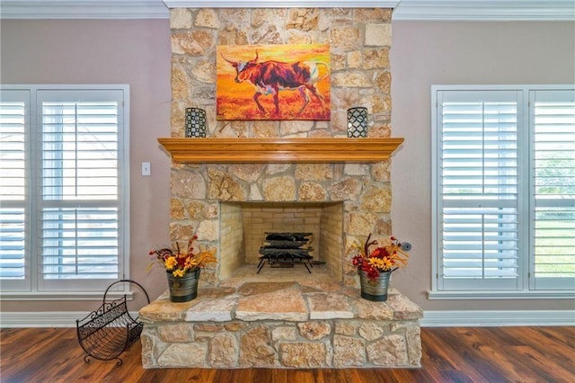 interior details with hardwood / wood-style flooring, crown molding, and a fireplace