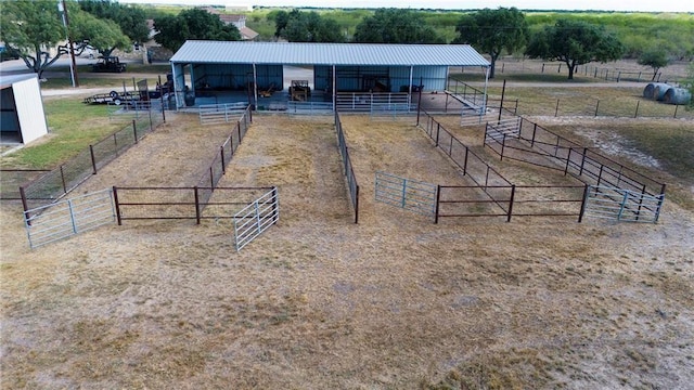 view of stable featuring a rural view