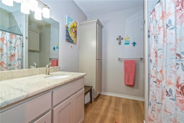 bathroom with vanity, hardwood / wood-style floors, and a shower with curtain