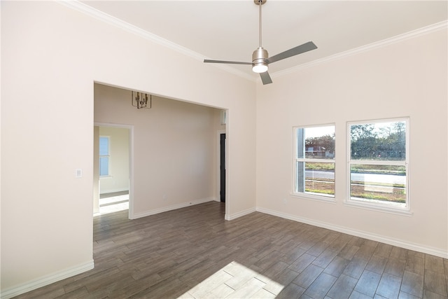 spare room featuring ornamental molding, ceiling fan, and dark wood-type flooring