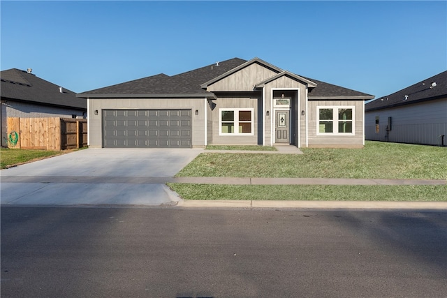 view of front facade with a front lawn and a garage