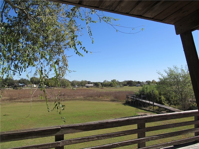 view of yard with a rural view