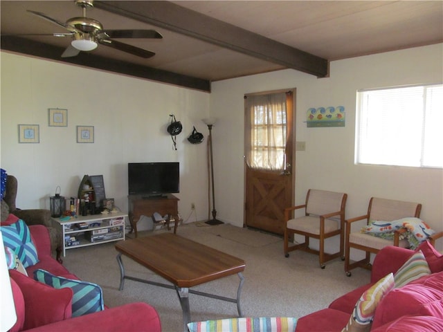 living room with ceiling fan, light colored carpet, and beamed ceiling