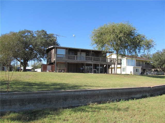 rear view of house with a lawn