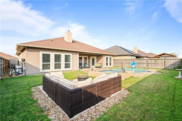 6713 Wall St, Corpus Christi, TX 78414 - back of property featuring a patio, an outdoor hangout area, a chimney, a lawn, and a fenced backyard