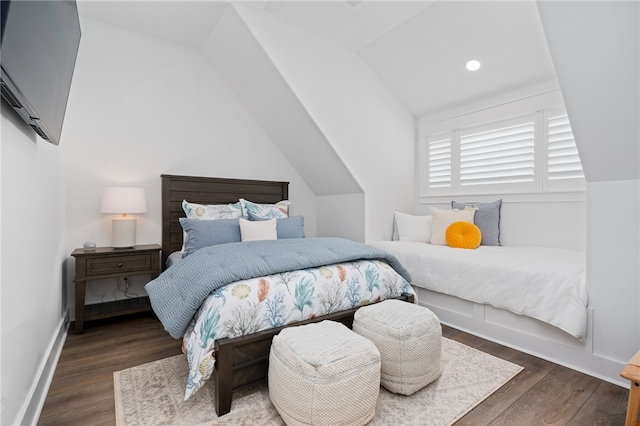 bedroom featuring dark wood-type flooring and lofted ceiling