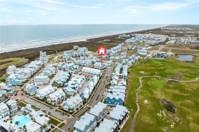 bird's eye view featuring a water view and a view of the beach