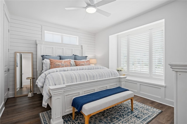 bedroom featuring ceiling fan and dark hardwood / wood-style floors