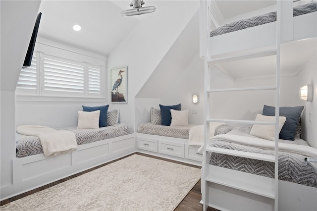 bedroom featuring vaulted ceiling and dark wood-type flooring