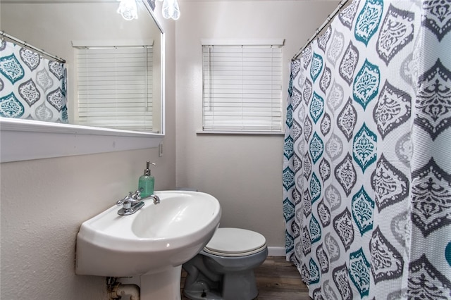 bathroom featuring toilet, a shower with curtain, sink, and wood-type flooring