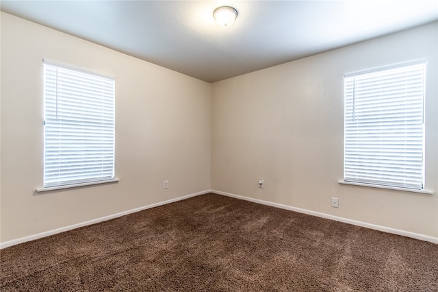 unfurnished room with carpet flooring