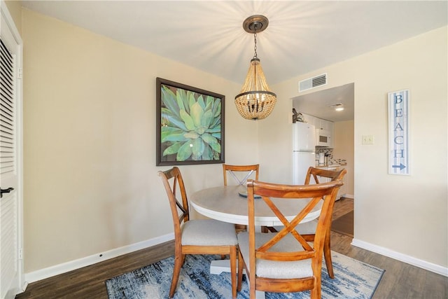 14300 Aloha St Unit 134, Corpus Christi, TX 78418 - dining room featuring a chandelier and wood finished floors
