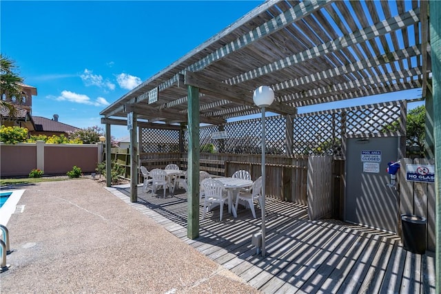 14300 Aloha St Unit 134, Corpus Christi, TX 78418 - fenced backyard featuring a pergola, outdoor dining area, and a patio
