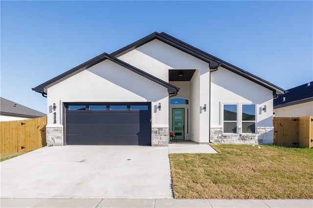 view of front of property with a garage, stone siding, and stucco siding