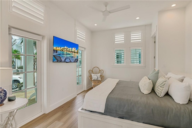 bedroom with access to outside, ceiling fan, and light wood-type flooring