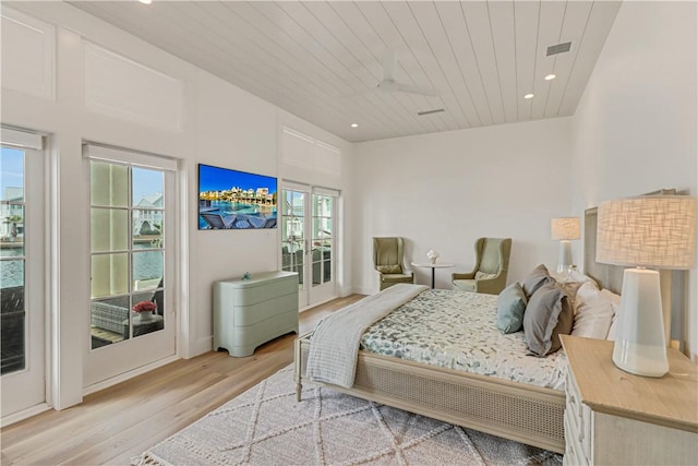 bedroom featuring access to outside, wooden ceiling, and light wood-type flooring