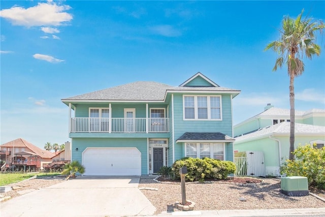 13534 Bullion Ct, Corpus Christi, TX 78418 - view of front facade featuring a garage, driveway, central AC unit, and roof with shingles