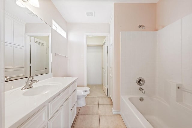 13534 Bullion Ct, Corpus Christi, TX 78418 - bathroom with toilet, tile patterned floors, vanity, and tub / shower combination