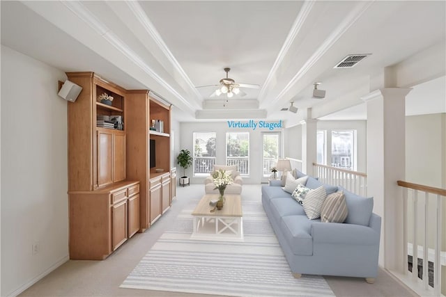 13534 Bullion Ct, Corpus Christi, TX 78418 - living area featuring ornate columns, ornamental molding, light colored carpet, ceiling fan, and a tray ceiling