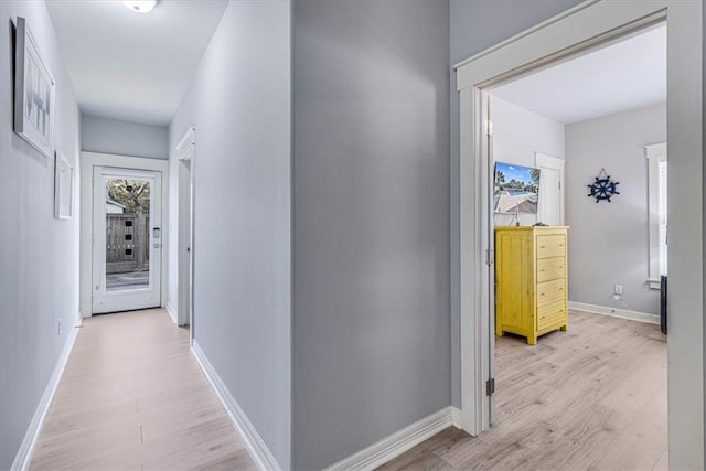 corridor with light wood-type flooring