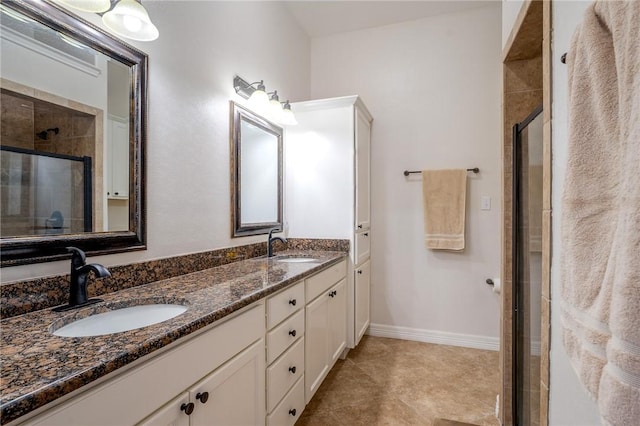 bathroom with tile patterned floors, vanity, and a shower with shower door