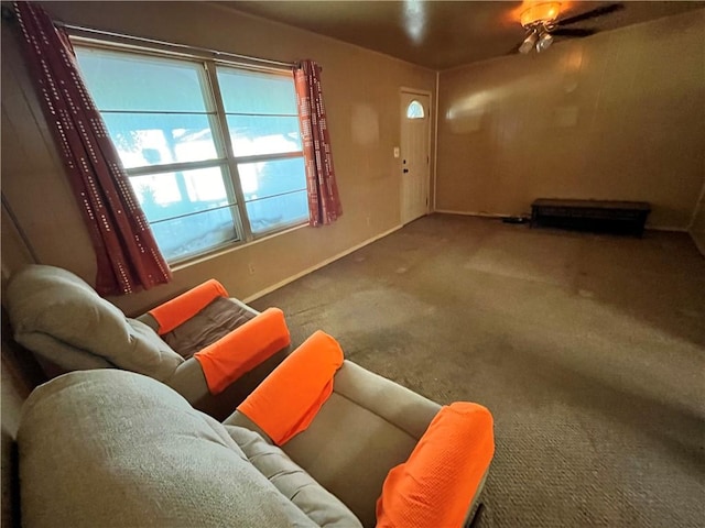 interior space featuring carpet floors and ceiling fan