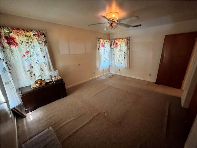 unfurnished bedroom with carpet flooring and ceiling fan