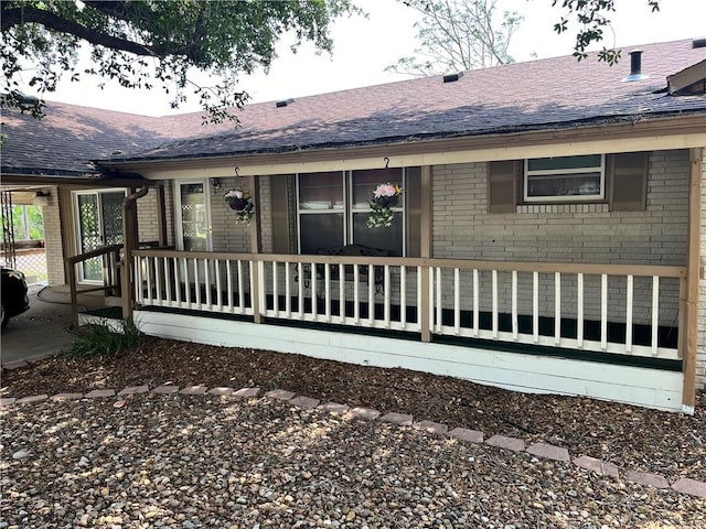 back of house with covered porch