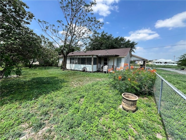 view of yard with a sunroom