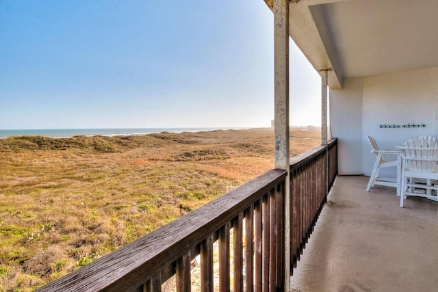 balcony featuring a water view