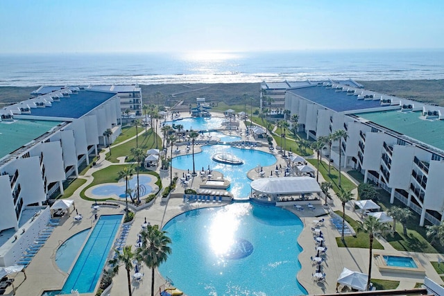 birds eye view of property with a water view