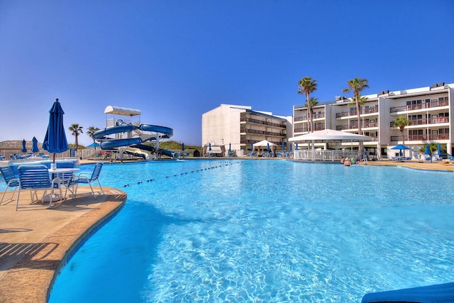 view of pool featuring a water slide