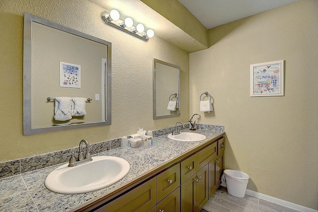 bathroom with hardwood / wood-style floors and vanity