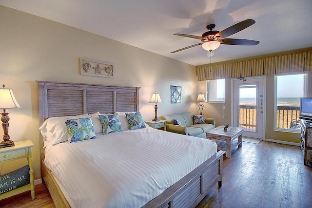 bedroom with access to outside, wood-type flooring, and ceiling fan