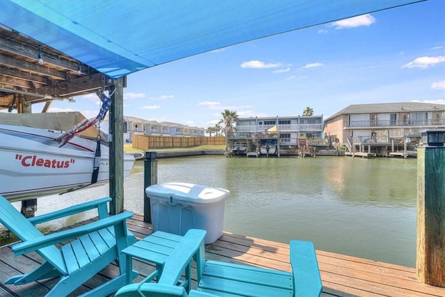 dock area with a residential view and a water view