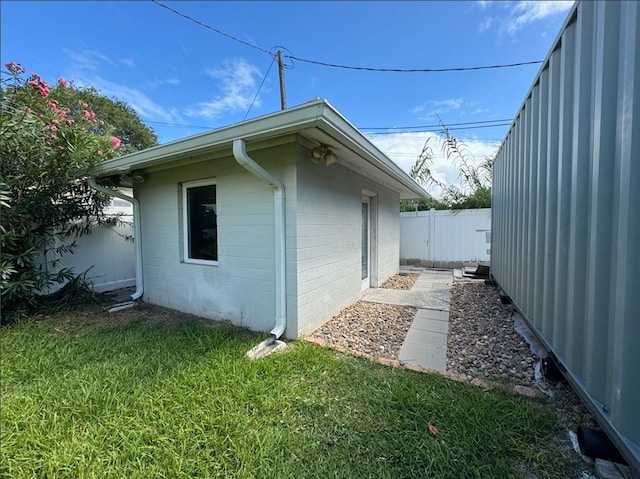 view of property exterior featuring a yard