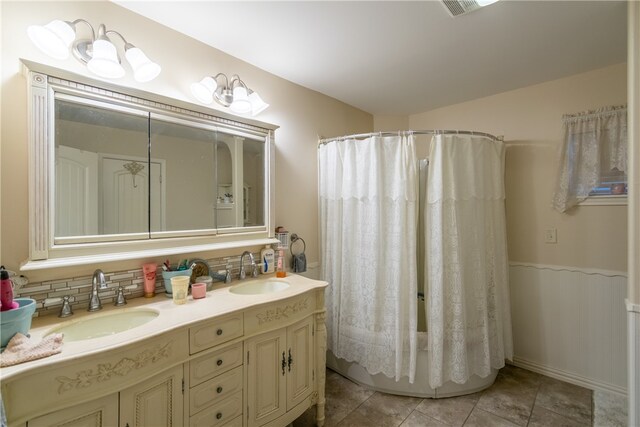 bathroom with vanity, tile patterned floors, backsplash, and a shower with curtain