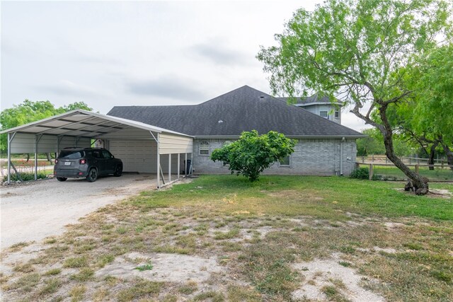 view of property exterior featuring a carport and a yard