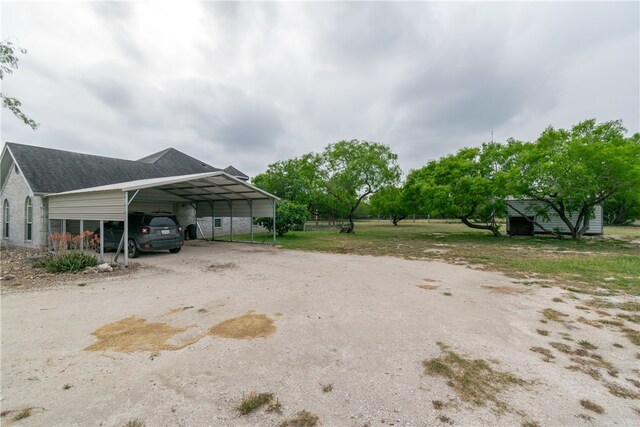 view of parking with a carport