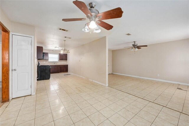 529 Blanco St, Taft, TX 78390 - unfurnished living room with a ceiling fan and light tile patterned flooring