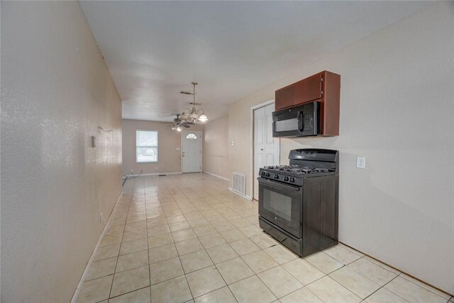 529 Blanco St, Taft, TX 78390 - kitchen with black appliances, light tile patterned floors, and ceiling fan