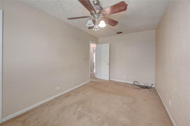 529 Blanco St, Taft, TX 78390 - empty room with light colored carpet, a textured ceiling, and ceiling fan