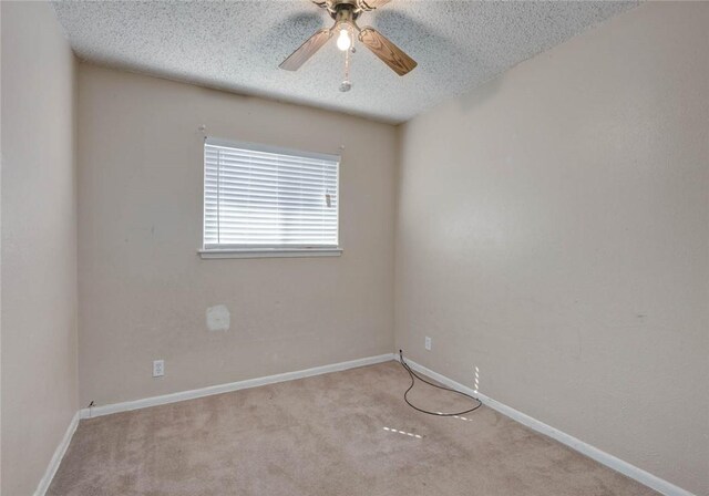 529 Blanco St, Taft, TX 78390 - spare room with a textured ceiling, ceiling fan, and carpet floors