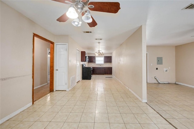 529 Blanco St, Taft, TX 78390 - kitchen featuring light tile patterned floors, electric panel, ceiling fan, light countertops, and decorative light fixtures
