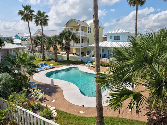 view of swimming pool featuring a patio area