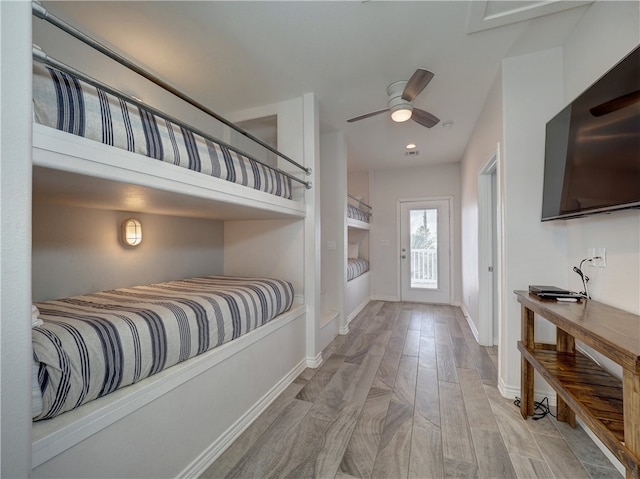 bedroom featuring ceiling fan and light hardwood / wood-style floors