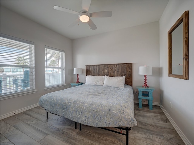 bedroom featuring ceiling fan and hardwood / wood-style flooring